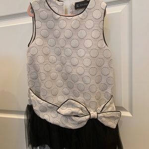 Girls dress Chanel like in ivory and black